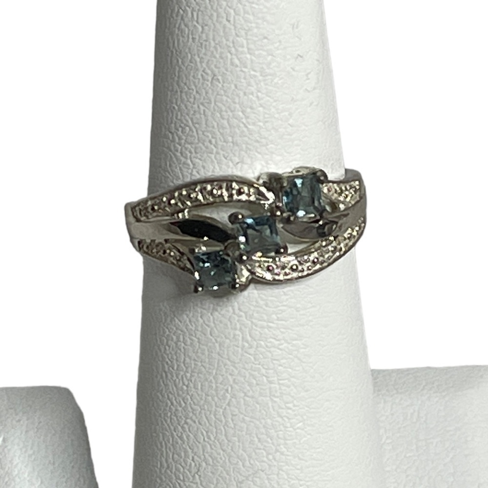 Sterling Silver Fashion ring with light blue stones size 6